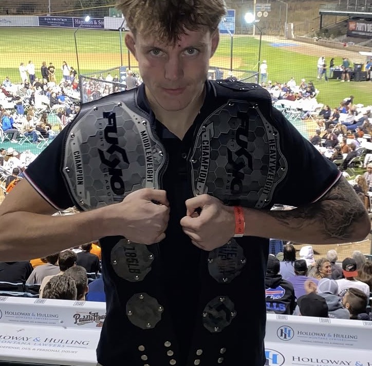 Sean Polk walking out with his championship belt